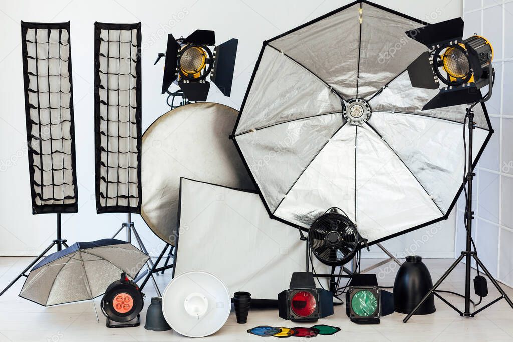 Photo studio accessories equipment and flashes of a professional photographer