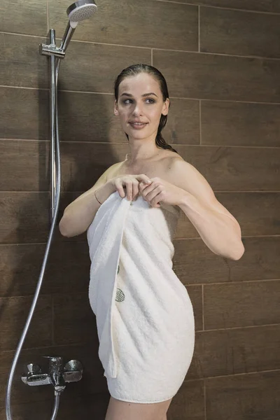 Beautiful young woman with a towel after bath. — Stock Photo, Image