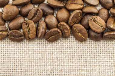 Çuval bezi çul tuval ve kahve çekirdekleri fotoğraf arka plan. Kopya 
