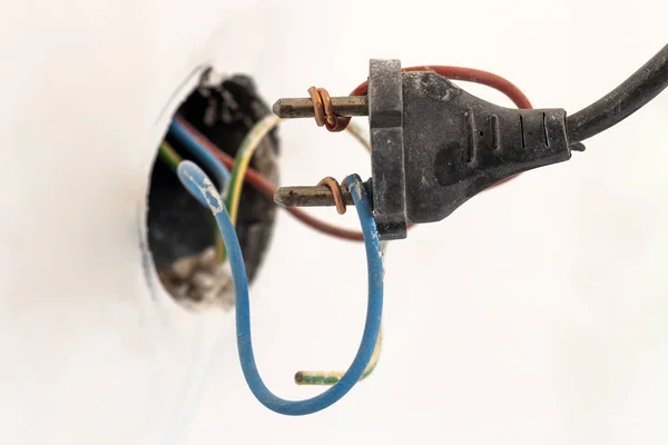 Badly wired plug showing bad and wrong and dangerous connection — Stock Photo, Image