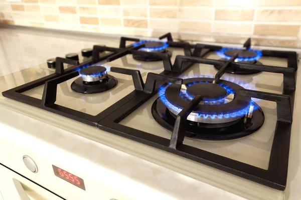 Closeup shot of blue fire from domestic kitchen stove. Gas cooke — Stock Photo, Image