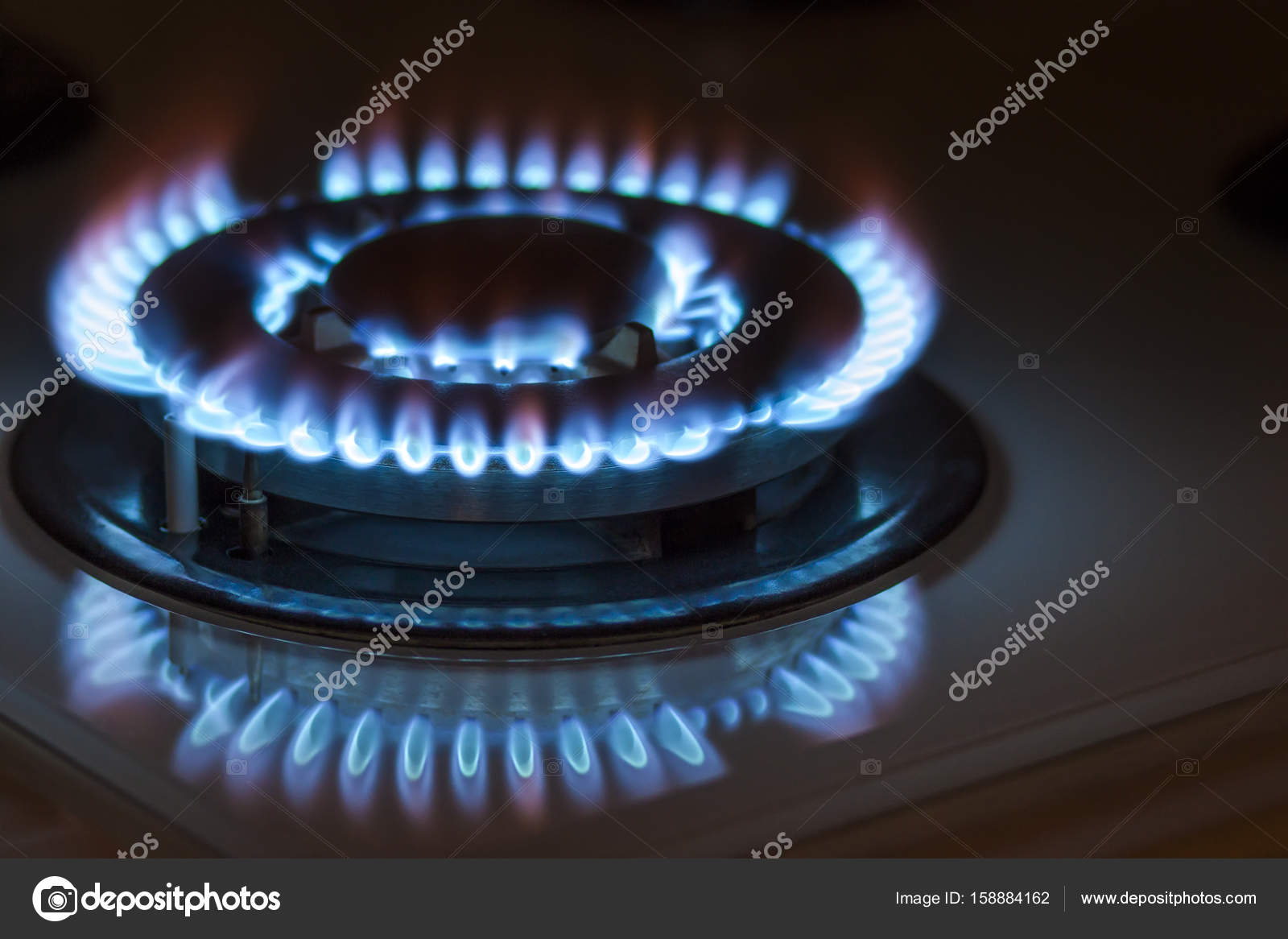 Closeup Shot Of Blue Fire From Domestic Kitchen Stove Gas Cooke Closeup Shot Of Blue Fire From Domestic Kitchen Stove Gas Cooke Stock Photo