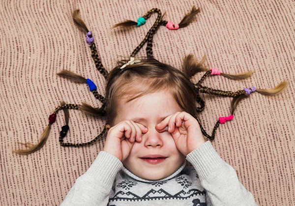 Close-up portrait of little child girl with hair braids — Stock Photo, Image