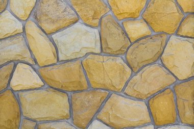 Kum taşı farklı boyutlarda. Taş duvar desen arka plan