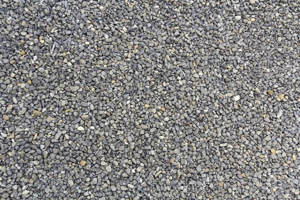 Close up shot of gravel rocks pebble stones as a background — Fotografia de Stock