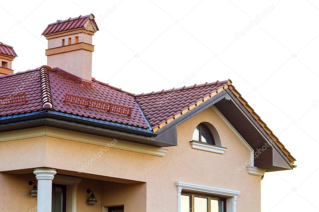 Roof on a new luxury house made of red natural bricks and a big 