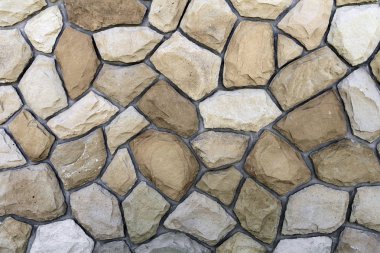 Kum taşı farklı boyutlarda. Taş duvar desen arka plan