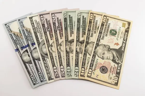 US american dollar money bills spread on white background