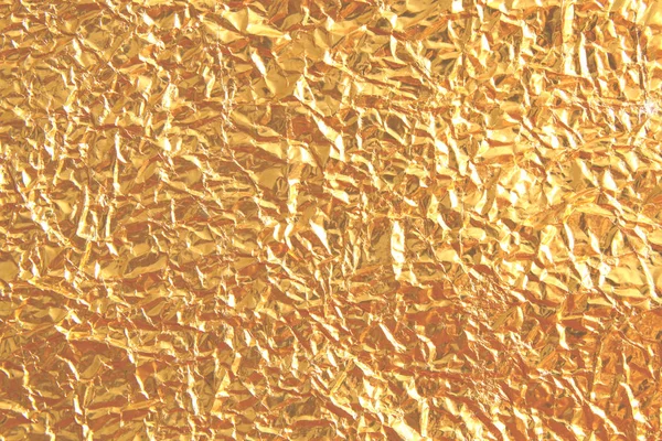 Shiny metal yellow golden texture background. Metallic gold patt