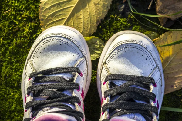 Pair of child white shoes on nature background — Stock Photo, Image