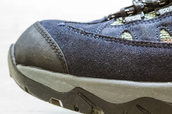Detail shot of fragmrnt of new fashionable hiking mountain boot. — Stock Photo, Image