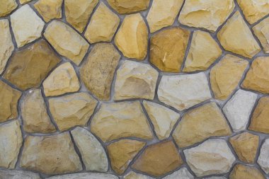 Kum taşı farklı boyutlarda. Taş duvar desen arka plan