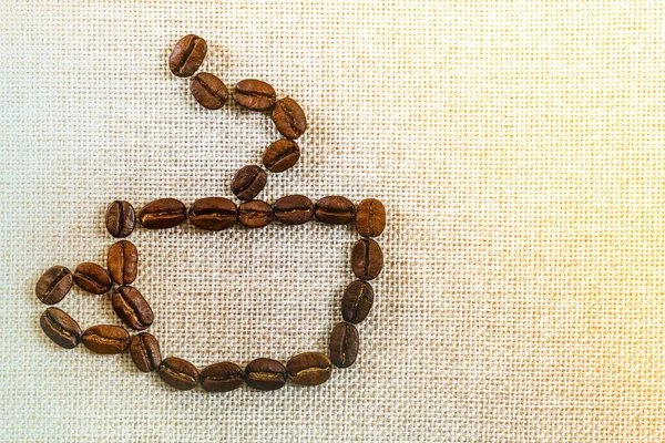 Sfondo foto tela di tela e chicchi di caffè. Copia — Foto Stock