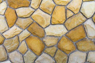 Kum taşı farklı boyutlarda. Taş duvar desen arka plan