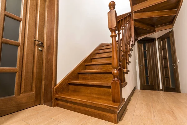 Modern brown oak wooden stairs  and doors in new renovated house — Stock Photo, Image