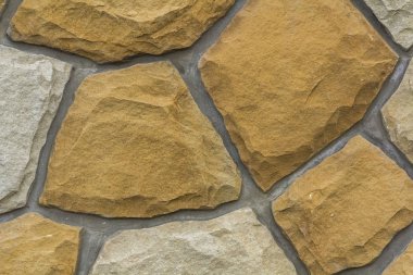 Kum taşı farklı boyutlarda. Taş duvar desen arka plan