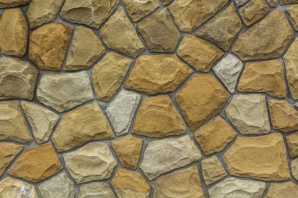 Olika storlekar av sand stenar. Stone wall mönster bakgrund — Stockfoto