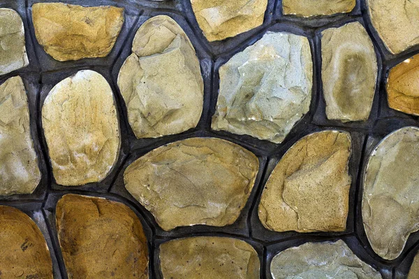 Olika storlekar av sand stenar. Stone wall mönster bakgrund — Stockfoto