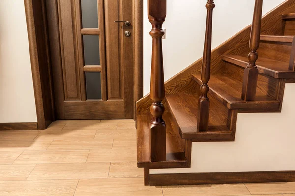 Modern brown oak wooden stairs  and doors in new renovated house — Stock Photo, Image