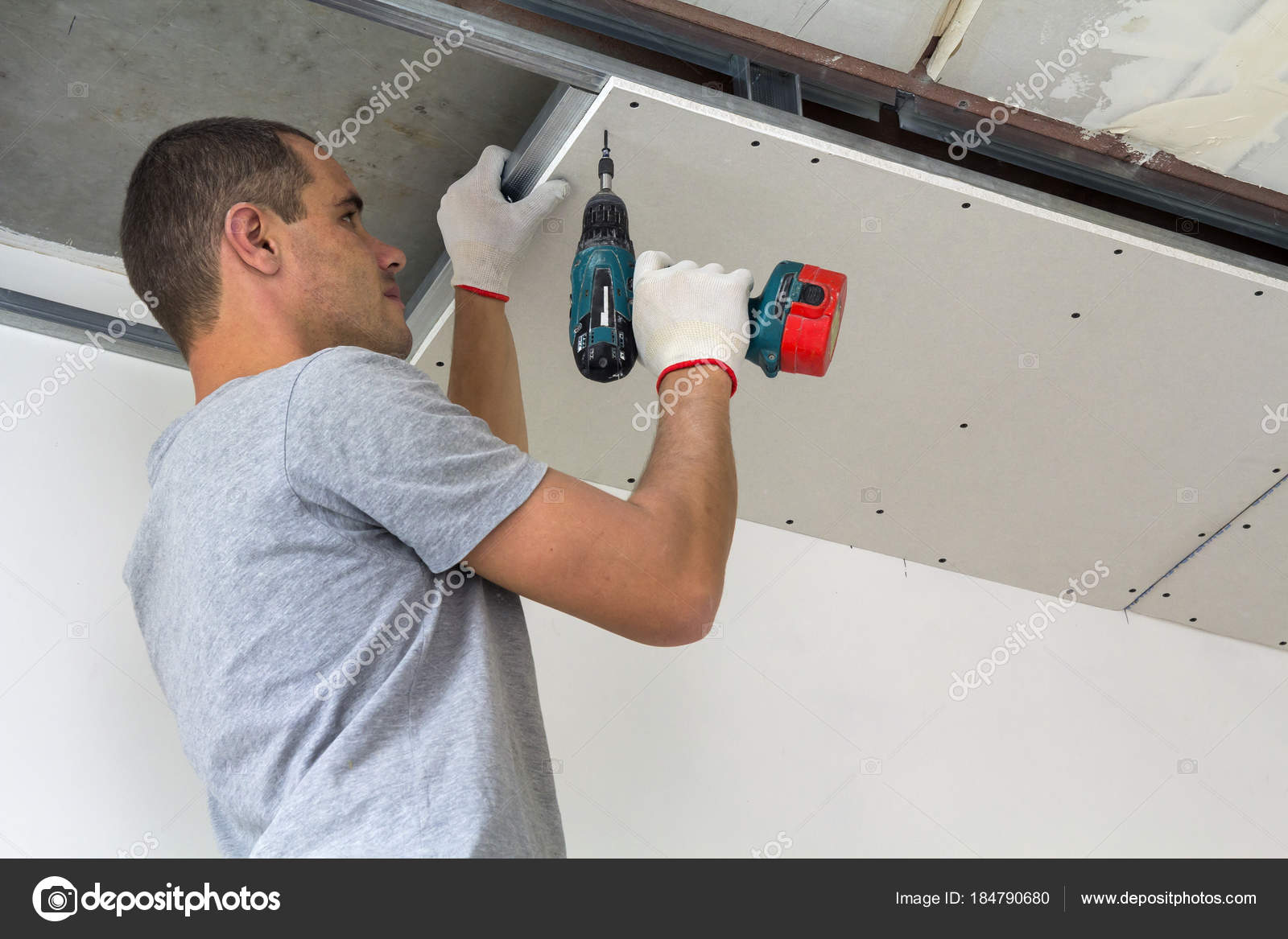 Construction worker assemble a suspended ceiling with drywall an — Stock  Photo © bilanol.i.ua #184790680, image size:1600x1167