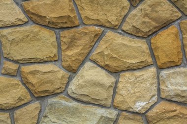 Kum taşı farklı boyutlarda. Taş duvar desen arka plan