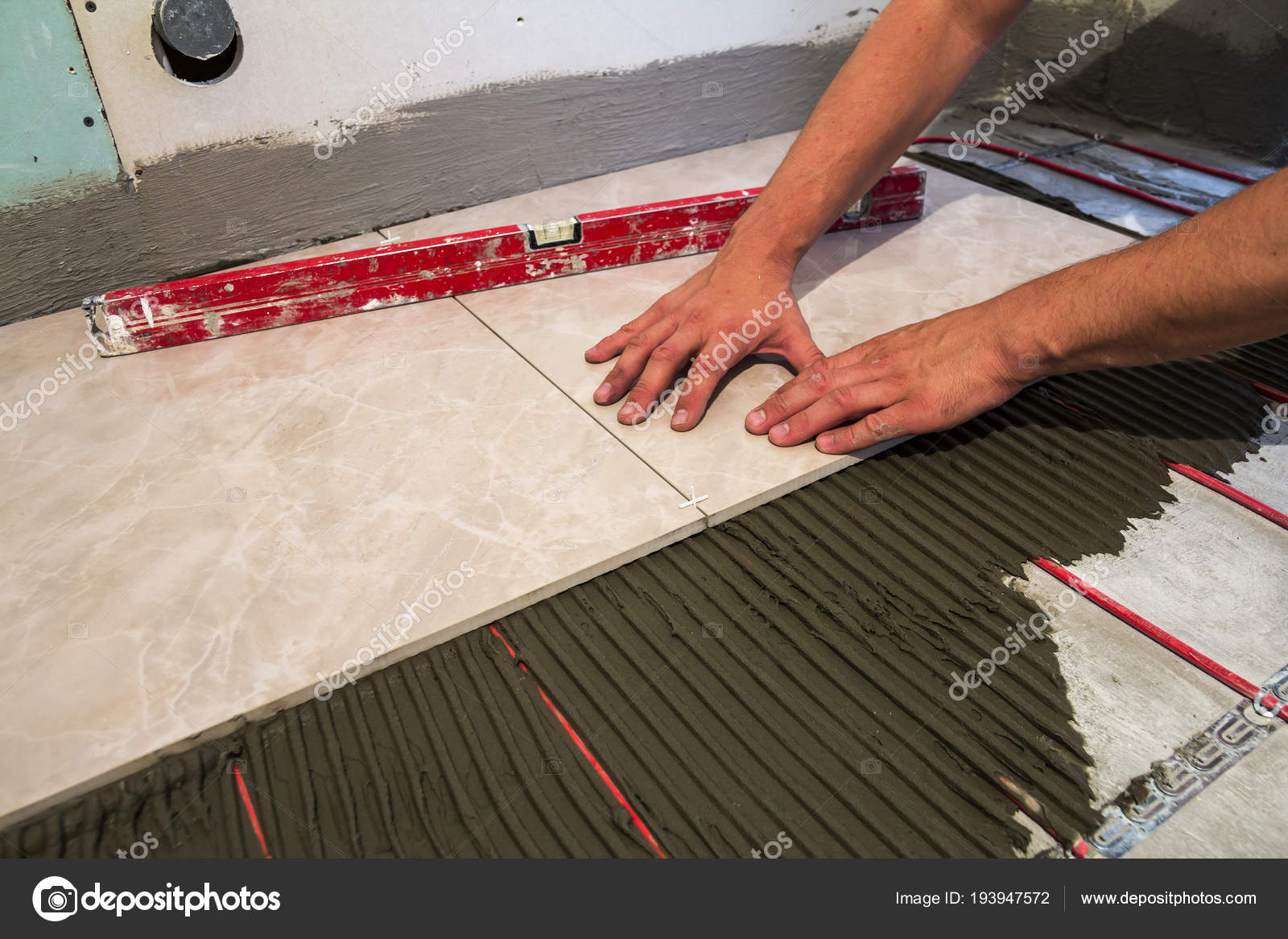 Ceramic Tiles Tools Tiler Worker Hand Installing Floor Home Ceramic Tiles And Tools For Tiler Worker Hand Installing Floor Home Improvement Renovation Tile Adhesive Mortar Level
