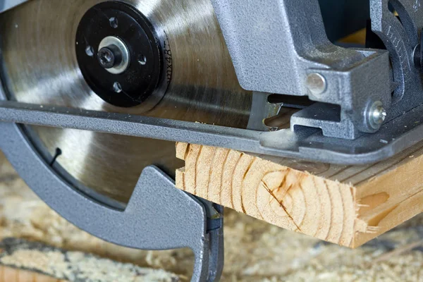 Close-up of new modern powerful circular electrical saw cutting — Stock Photo, Image