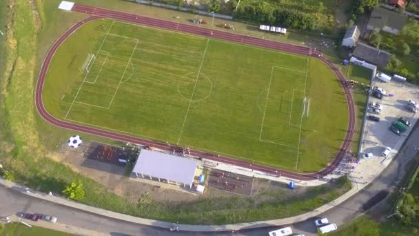Aerial View Football Field Stadium Covered Green Grass Rural Town — Stock Video