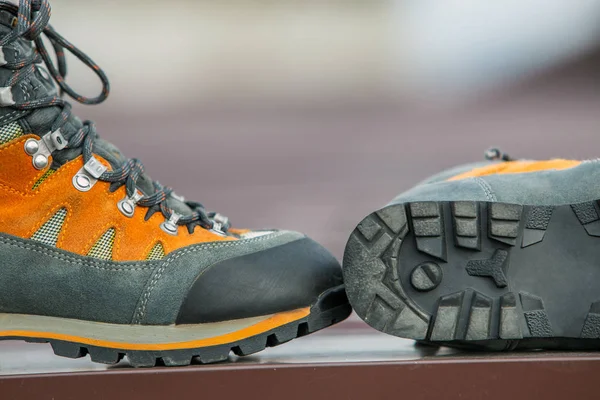 A pair of leather trekking hiking winter boots on blurred backgr — Stock Photo, Image