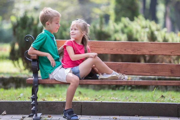 Portrait of two pretty cute children boy and girl having fun tim Stock Picture