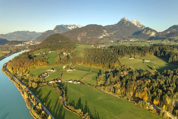 Aerial view of green meadows with villages and forest in austria — Stock Photo, Image