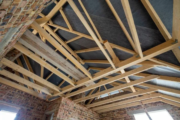 Attic space of a building under construction with wooden beams o — Stock Photo, Image
