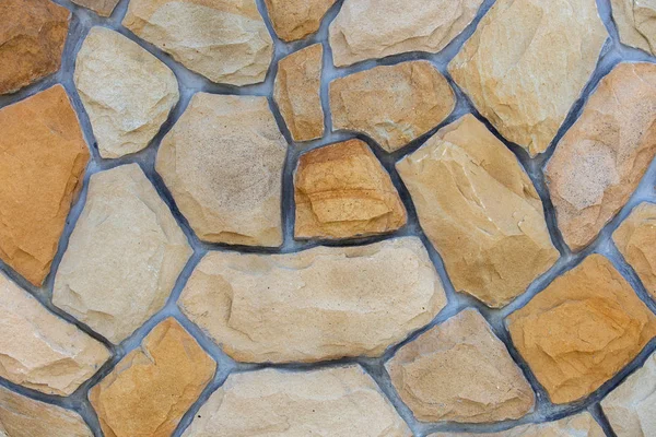 Поверхность абстрактной стены из песчаных камней для использования в качестве бэкграунда — стоковое фото