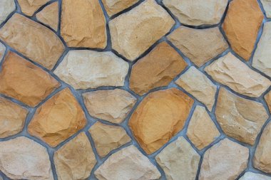 Kum taşlarından yapılmış soyut duvar yüzeyi gergedan olarak kullanılacak.