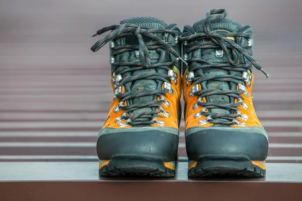 A pair of leather trekking hiking winter boots on blurred backgr — Stock Photo, Image