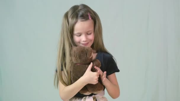 Pretty Child Girl Playing Her Teddy Bear Toy — Stock Video