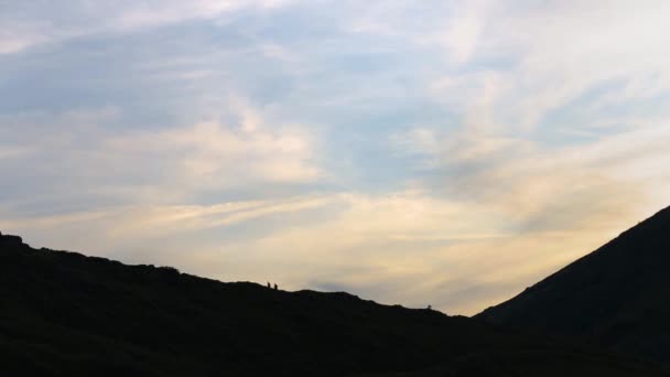 Dark Silhouettes Hikers Trekking Evening Mountain Terrain — Stock Video