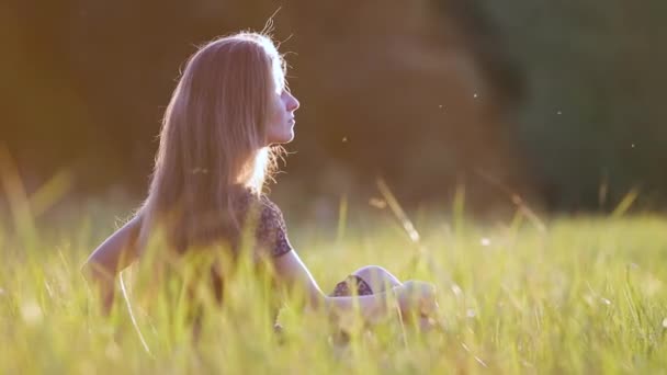 Young Woman Long Hair Sitting Outdoors Summer Field Grass Enjoying — Stockvideo