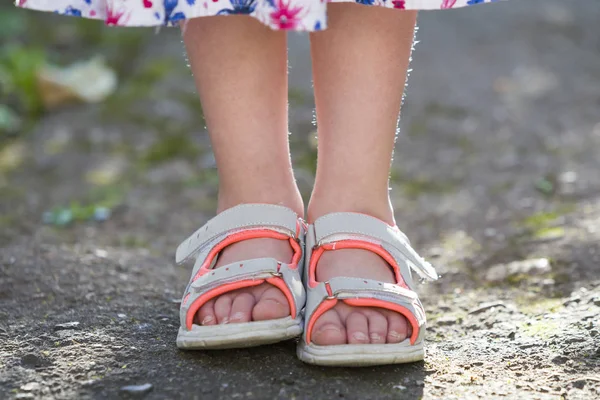 Close up of child girl feet wearing summer sandals shoes — Stock Photo, Image