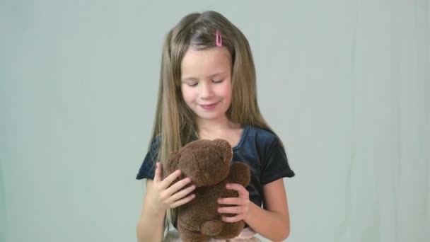 Pretty Child Girl Playing Her Teddy Bear Toy — Stock Video