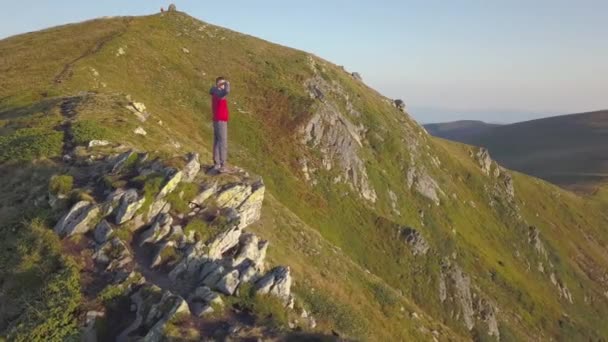 Hiker Standing Top Rocky Mountain Enjoying Magnificent View Mountaineer Looking — Stock Video