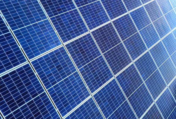 Close-up surface of lit by sun blue shiny solar photo voltaic pa