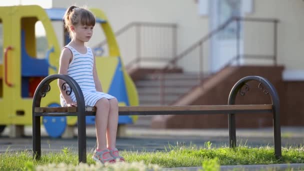 Sad Child Girl Waiting Her Mother Sitting Bench Summer Playground — Stock Video