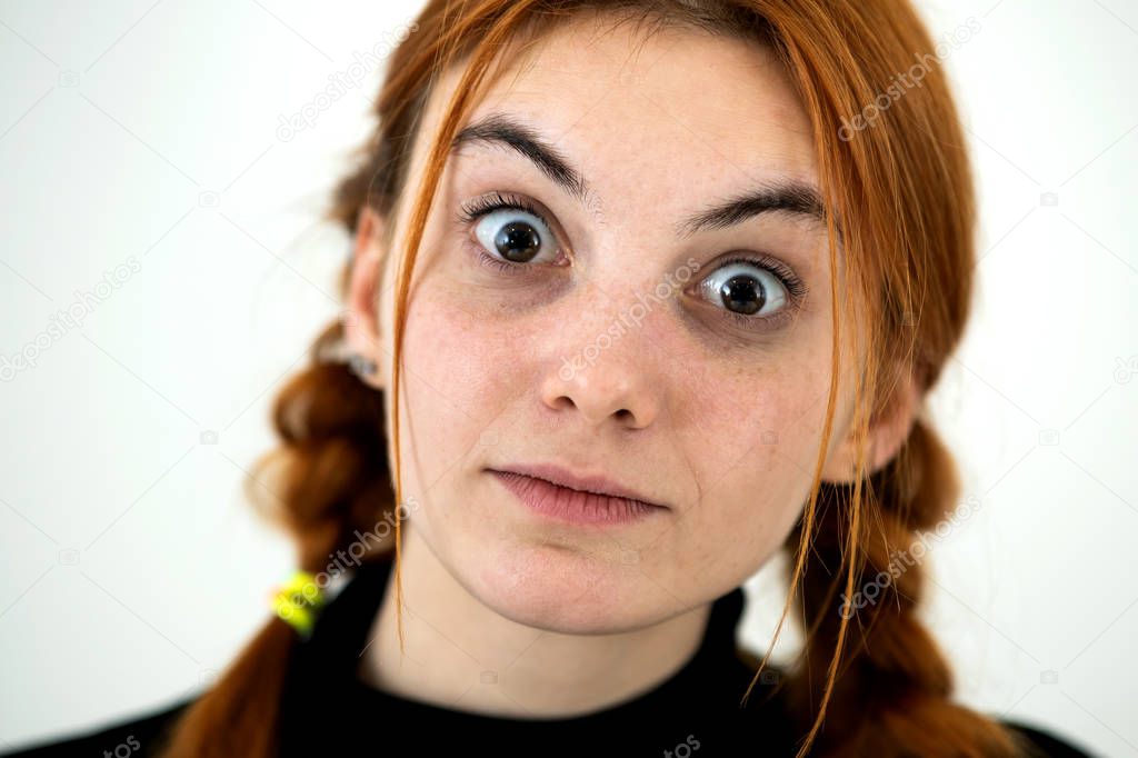 Close up portrait of innocent looking redhead pretty teenage gir