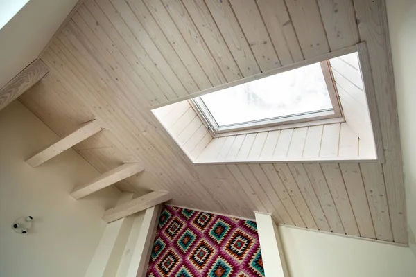 Wooden ceiling in a contemporary mansard room with attic window — Stock Image Wooden ceiling in a contemporary mansard room with attic window Stock Picture