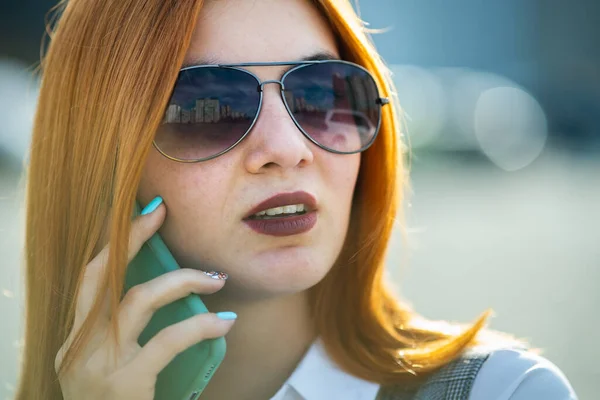 Closeup Portrait Fashionable Young Redhead Woman Sunglasses Talking Cell Phone — Stock Photo, Image