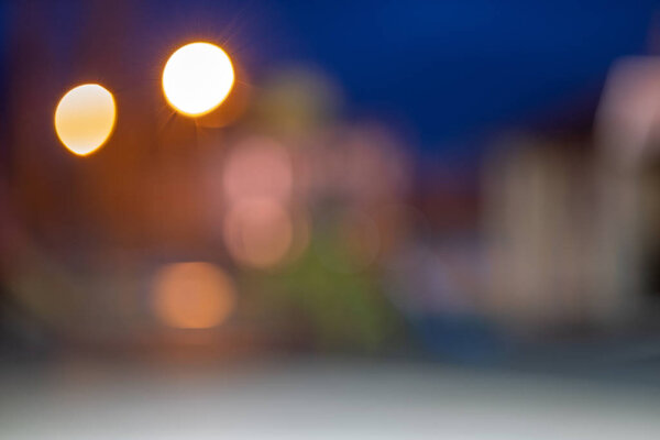 Bright colorful bokeh circles at night. Blurred city lights background.