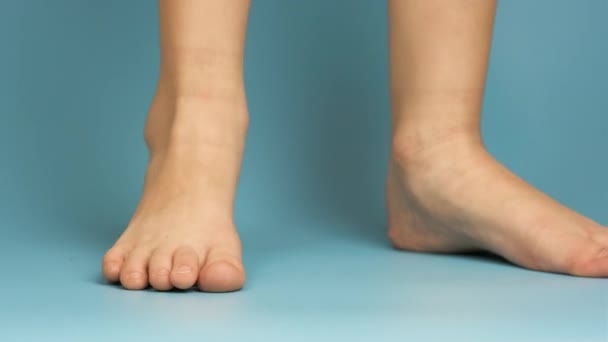 Close Bare Child Feet Blue Background — Stock Video