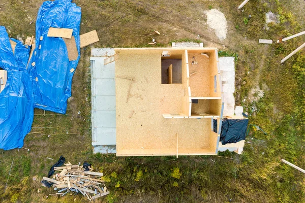 Construction of new and modern modular house. Walls made from composite wooden sip panels with styrofoam insulation inside. Building new frame of energy efficient home concept.