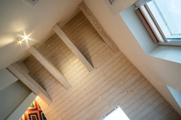 Wooden ceiling in a contemporary mansard room with attic window ob decorative planks surface. — Stock Image Wooden Ceiling Contemporary Mansard Room Attic Window Decorative Planks Surface Stock Picture